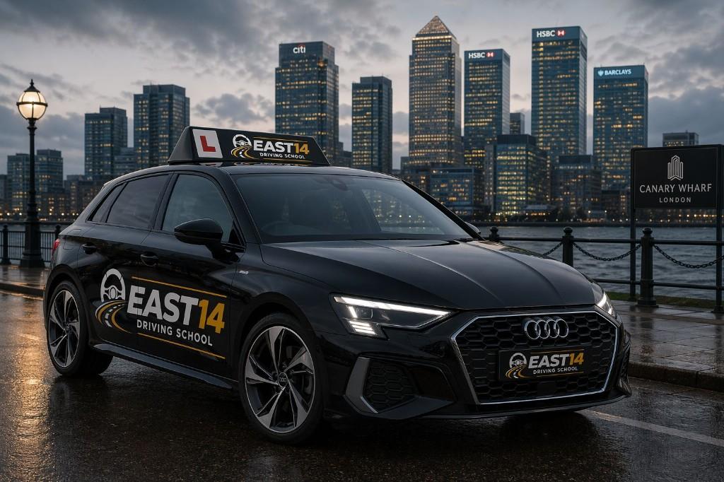 East 14 Driving School branded car at Canary Wharf, London skyline at dusk